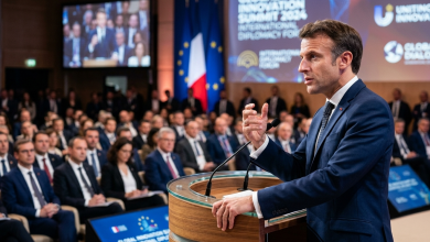 A high‑resolution image of French President Emmanuel Macron addressing the summit podium at the 4th AI Impact Summit in Mumbai